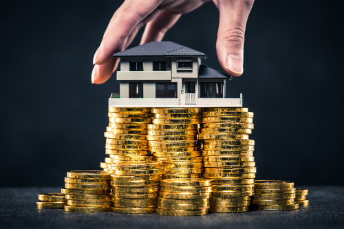 Münzen und Modellhaus